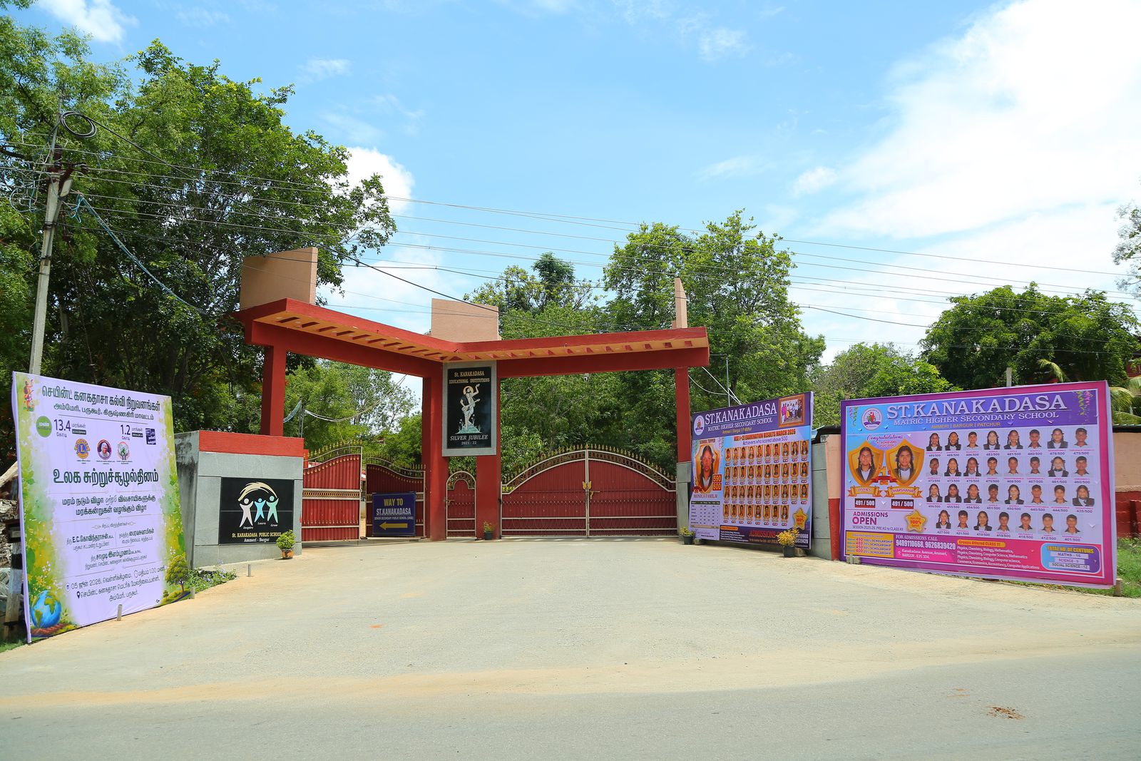 School entrance gate with signboards