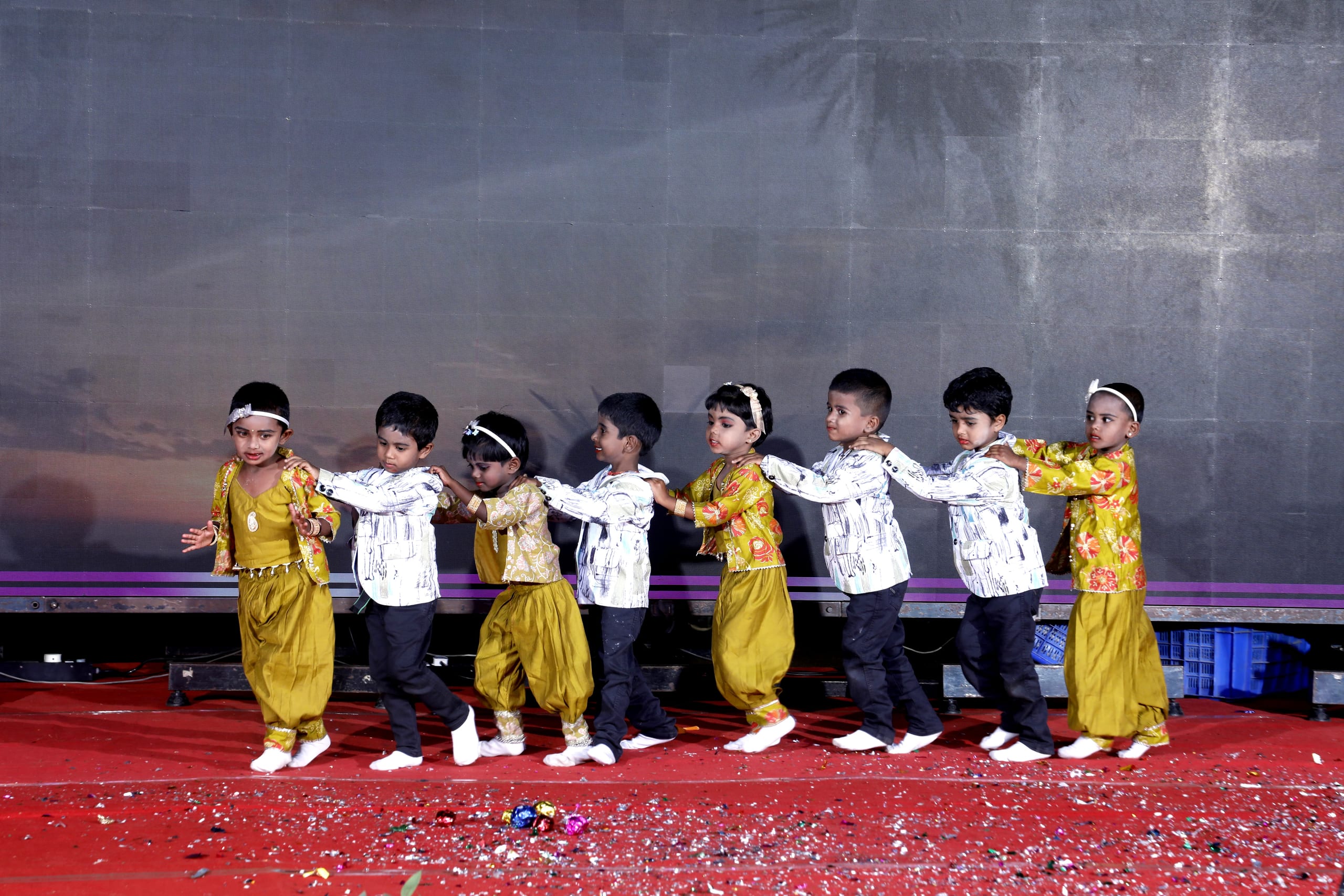Young children performing on stage