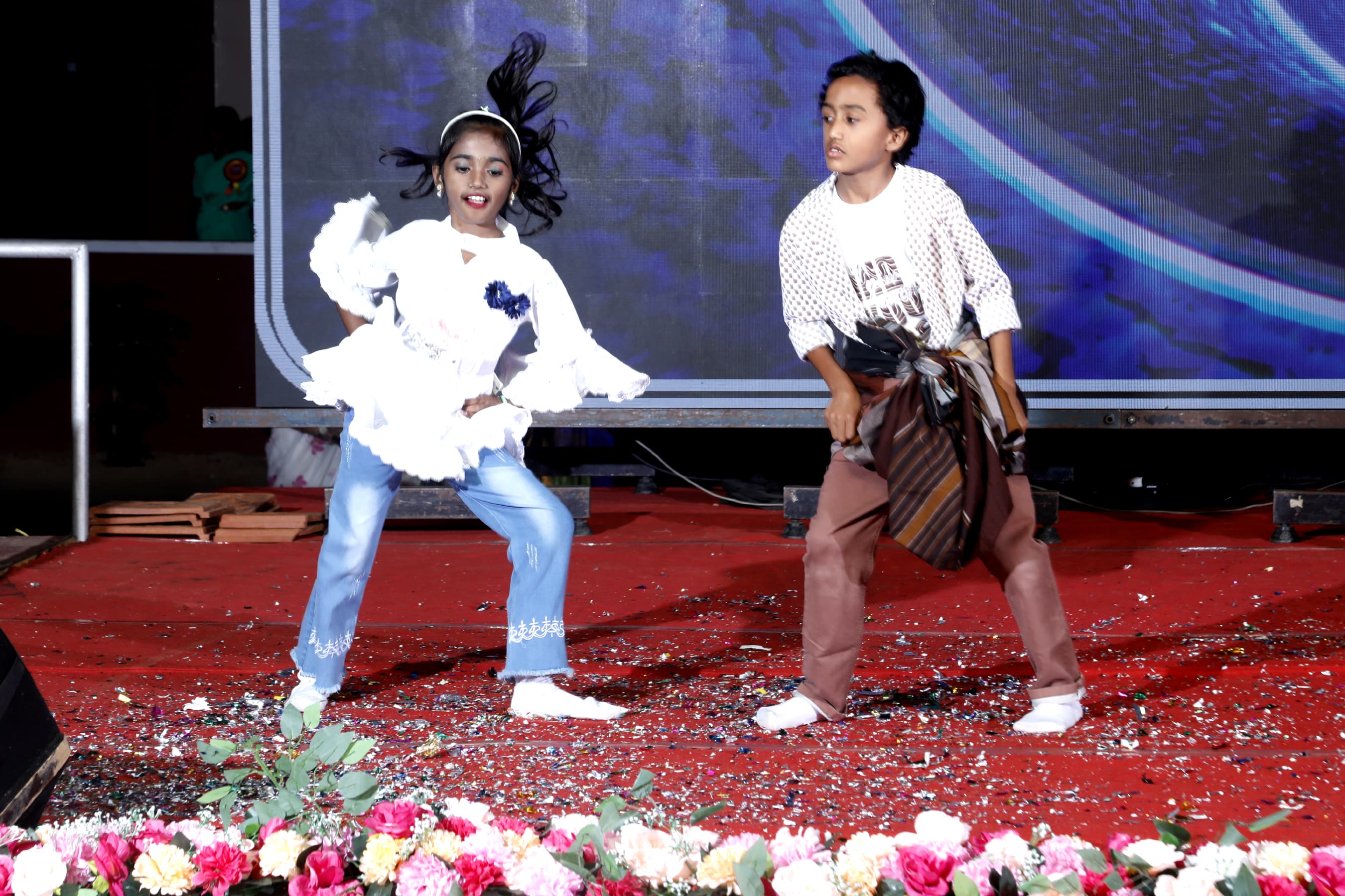 Students performing on stage at a school function