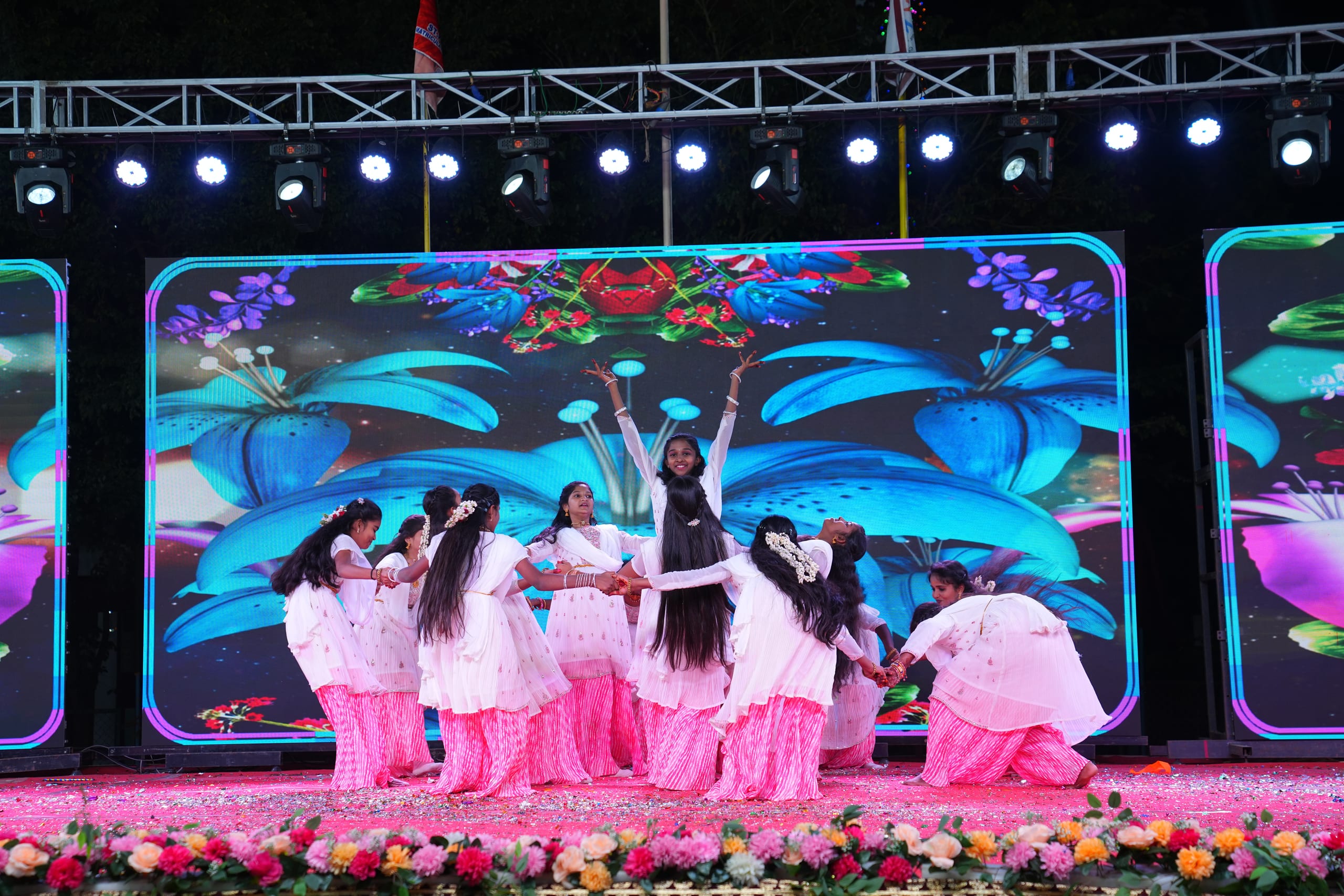 Students performing a dance on stage