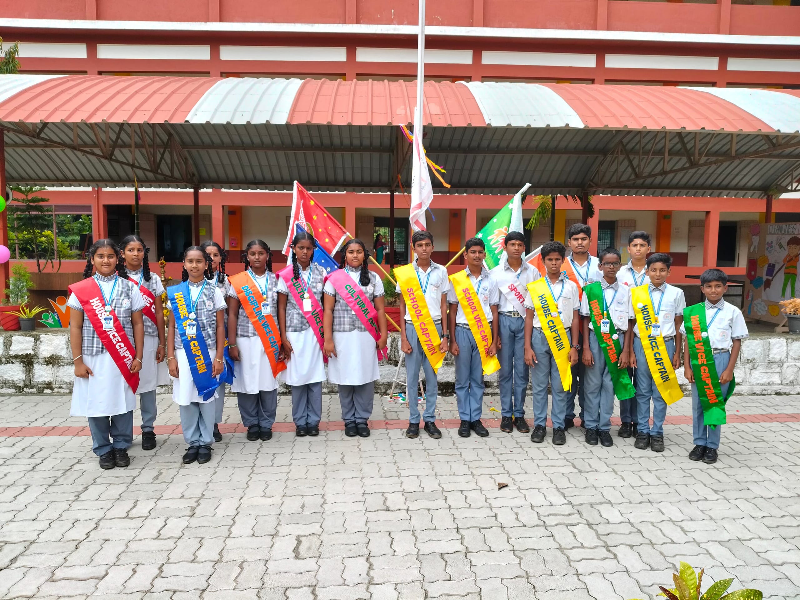 Student leaders standing in line wearing sashes