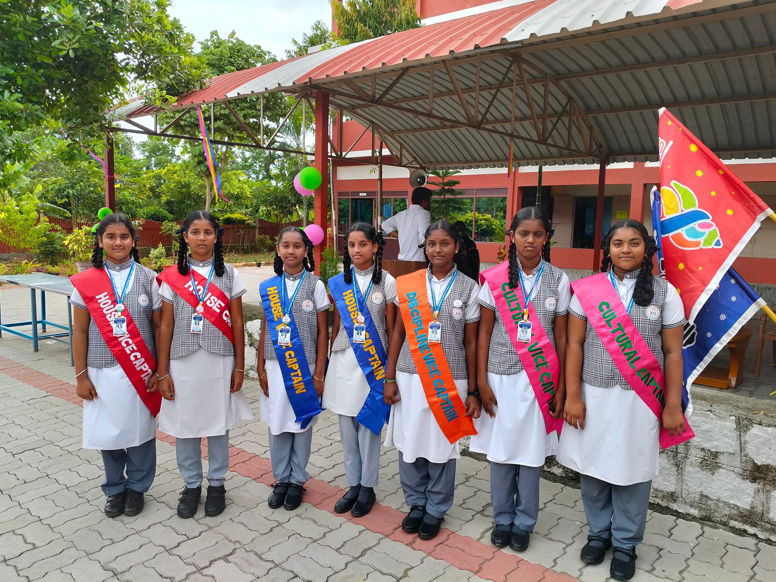 Girls wearing student council sashes standing in a group