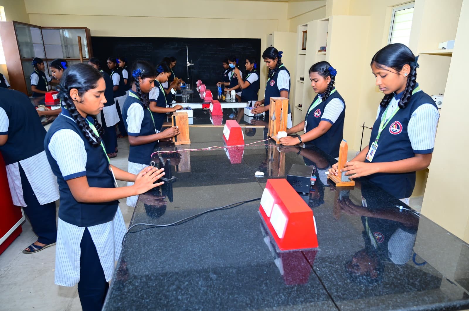 Students with apparatus in the physics laboratory