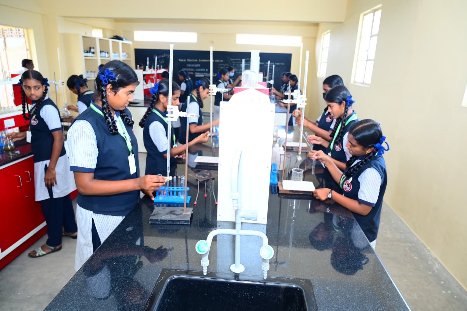 Students doing chemistry practicals in the laboratory