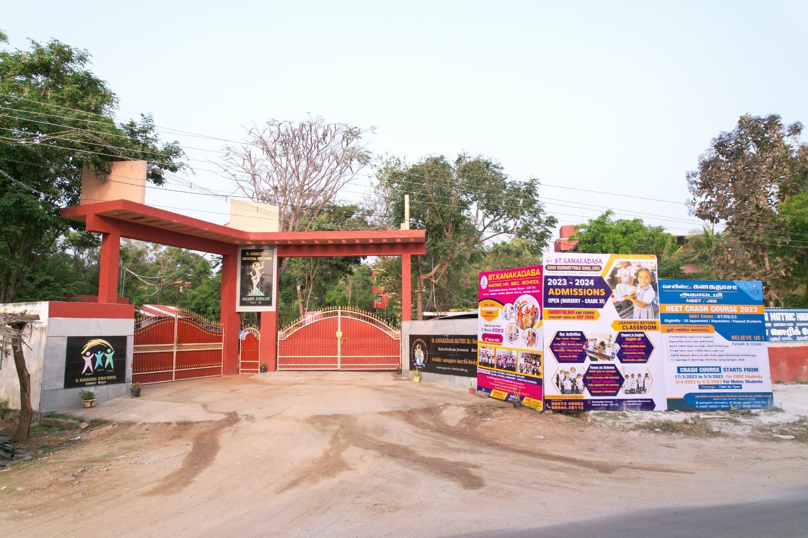 Entrance gate of the school campus with signboards