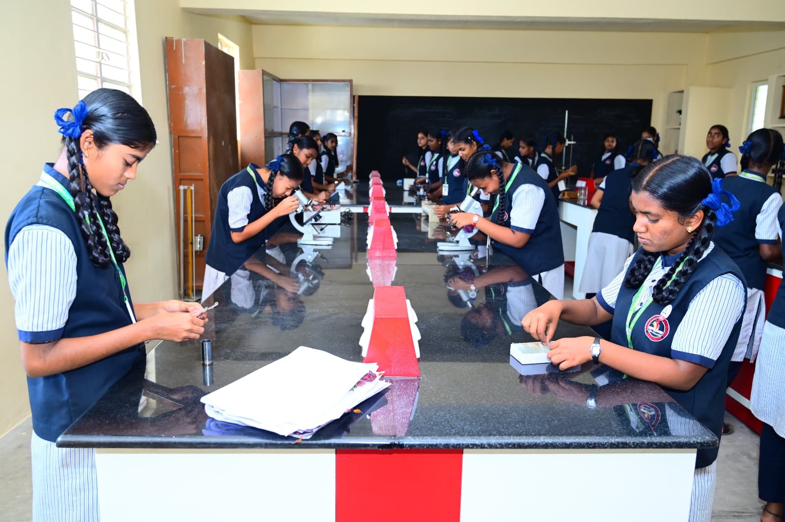 Students using microscopes in the laboratory