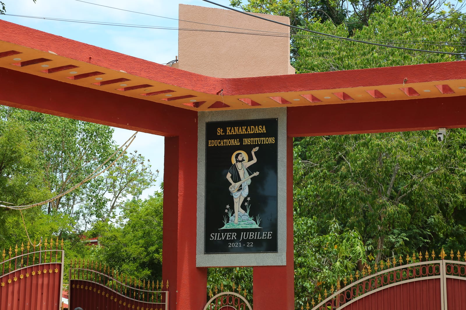 The entrance gate of St. Kanakadasa Educational Institutions with the Silver Jubilee board